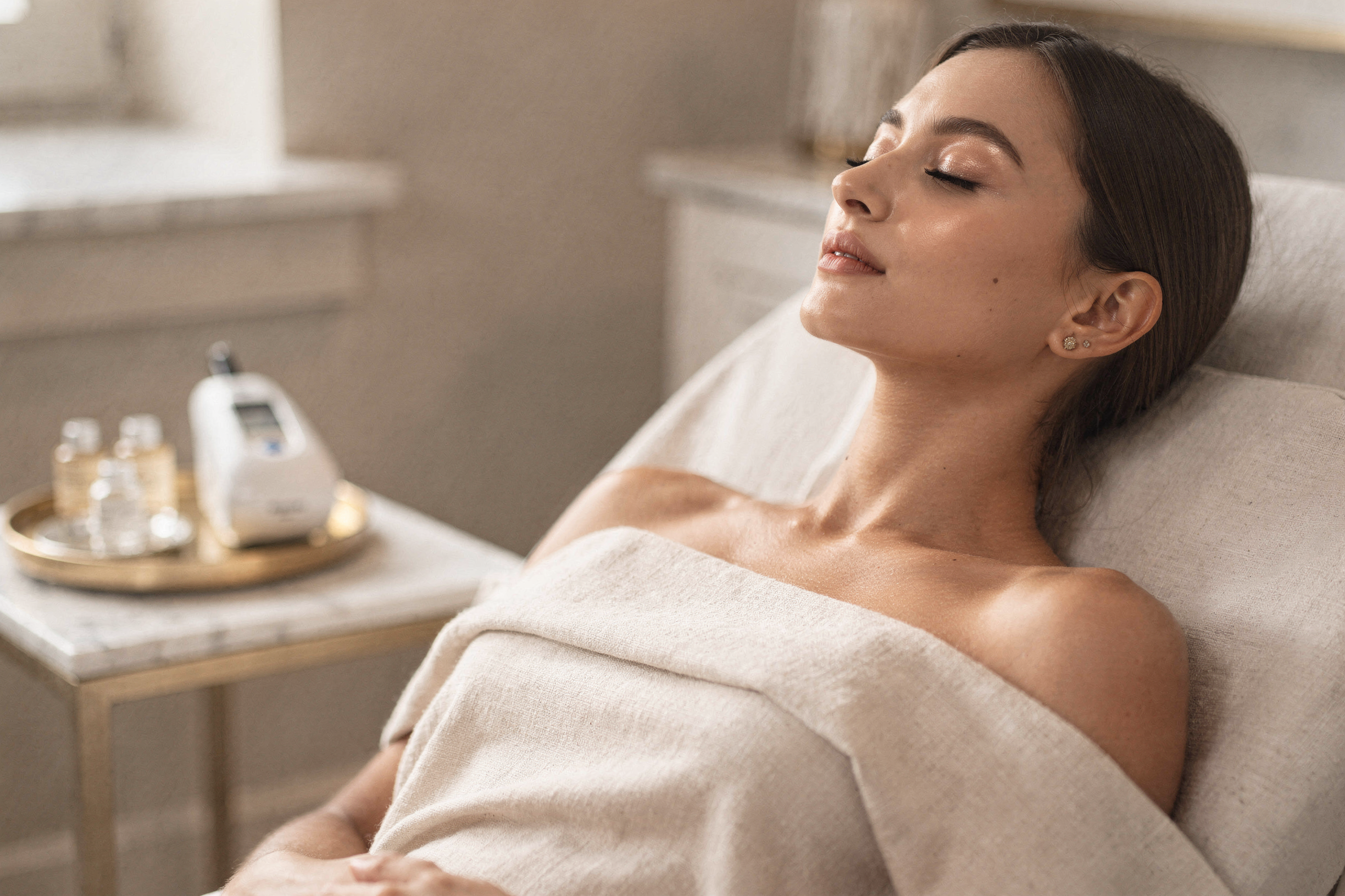 Patient relaxing during microneedling treatment at Natural Beauty Fifth Avenue's East Village location